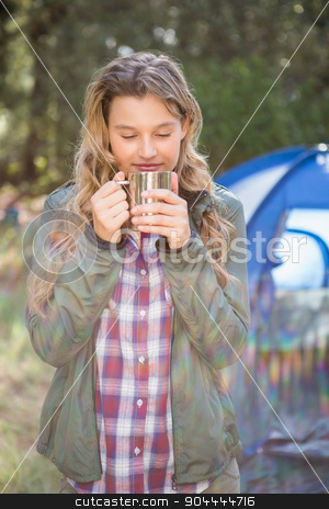 To use this stock image in your creative project, please select the size you need over to the right and click the "Add to Cart" button.
Your downloaded image will come with the Cutcaster watermark removed so don’t worry about the watermark you see on this page. Pretty blonde camper enjoying beverage in front of tent stock photo, Pretty blonde camper enjoying beverage in front of tent in the nature by Wavebreak Media