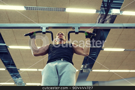 To use this stock image in your creative project, please select the size you need over to the right and click the "Add to Cart" button.
Your downloaded image will come with the Cutcaster watermark removed so don’t worry about the watermark you see on this page. young man exercising in gym stock photo, sport, fitness, lifestyle and people concept - young man doing pull-ups in gym by Syda Productions