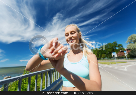 To use this stock image in your creative project, please select the size you need over to the right and click the "Add to Cart" button.
Your downloaded image will come with the Cutcaster watermark removed so don’t worry about the watermark you see on this page. happy woman with heart rate watch and earphones stock photo, fitness, sport, people, technology and healthy lifestyle concept - smiling young woman with heart rate watch and earphones exercising outdoors by Syda Productions
