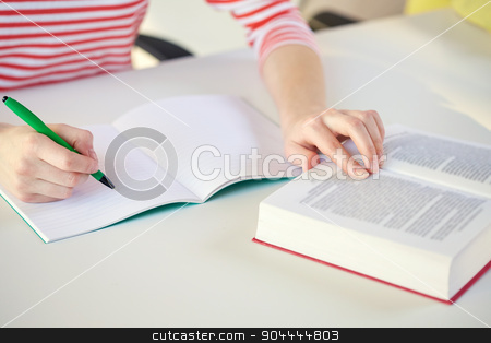 To use this stock image in your creative project, please select the size you need over to the right and click the "Add to Cart" button.
Your downloaded image will come with the Cutcaster watermark removed so don’t worry about the watermark you see on this page. close up of female hands with book and notebook stock photo, people and education concept - close up of female hands with book or textbook writing to notebook at school by Syda Productions