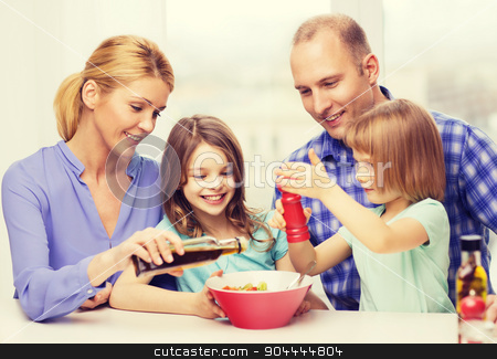 To use this stock image in your creative project, please select the size you need over to the right and click the "Add to Cart" button.
Your downloaded image will come with the Cutcaster watermark removed so don’t worry about the watermark you see on this page. happy family with two kids eating at home stock photo, food, family, children, hapiness and people concept - happy family with two kids making dinner at home by Syda Productions