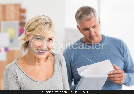 To use this stock image in your creative project, please select the size you need over to the right and click the "Add to Cart" button.
Your downloaded image will come with the Cutcaster watermark removed so don’t worry about the watermark you see on this page. Smiling business colleagues reading and using tablet stock photo, Smiling business colleagues reading and using tablet at office by Wavebreak Media