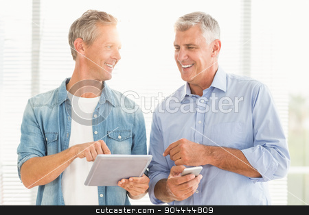 To use this stock image in your creative project, please select the size you need over to the right and click the "Add to Cart" button.
Your downloaded image will come with the Cutcaster watermark removed so don’t worry about the watermark you see on this page. Business colleagues working on tablet and phone stock photo, Smiling business colleagues working on tablet and phone at office by Wavebreak Media