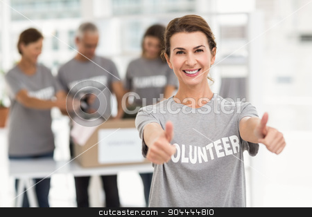 To use this stock image in your creative project, please select the size you need over to the right and click the "Add to Cart" button.
Your downloaded image will come with the Cutcaster watermark removed so don’t worry about the watermark you see on this page. Smiling female volunteer doing thumbs up stock photo, Portrait of smiling female volunteer doing thumbs up in the office by Wavebreak Media