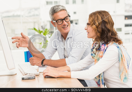 To use this stock image in your creative project, please select the size you need over to the right and click the "Add to Cart" button.
Your downloaded image will come with the Cutcaster watermark removed so don’t worry about the watermark you see on this page. Two casual designers working with computer stock photo, Two casual designers working with computer in the office by Wavebreak Media