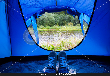 To use this stock image in your creative project, please select the size you need over to the right and click the "Add to Cart" button.
Your downloaded image will come with the Cutcaster watermark removed so don’t worry about the watermark you see on this page. close up of camper legs lying near tent entrance stock photo, camping, travel, tourism, hike and people concept - close up of camper legs lying near blur tent entrance and enjoying natural landscape by Syda Productions