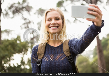 To use this stock image in your creative project, please select the size you need over to the right and click the "Add to Cart" button.
Your downloaded image will come with the Cutcaster watermark removed so don’t worry about the watermark you see on this page. Smiling female hiker taking a selfie stock photo, Smiling female hiker taking a selfie with smartphone by Wavebreak Media
