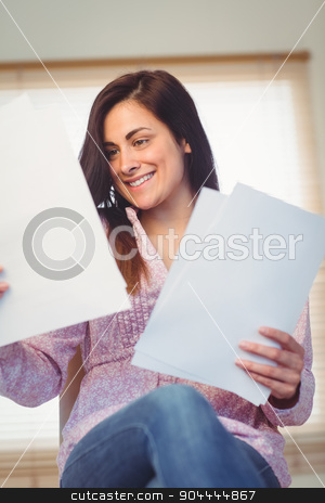 To use this stock image in your creative project, please select the size you need over to the right and click the "Add to Cart" button.
Your downloaded image will come with the Cutcaster watermark removed so don’t worry about the watermark you see on this page. Pretty brunette reading documents stock photo, Pretty brunette reading documents in a bright room by Wavebreak Media