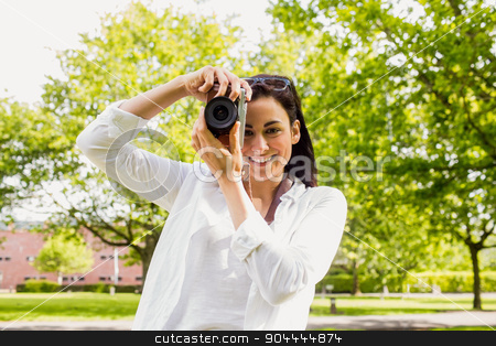 To use this stock image in your creative project, please select the size you need over to the right and click the "Add to Cart" button.
Your downloaded image will come with the Cutcaster watermark removed so don’t worry about the watermark you see on this page. Beautiful brunette taking photo in the park stock photo, Beautiful brunette taking photo in the park on a sunny day by Wavebreak Media