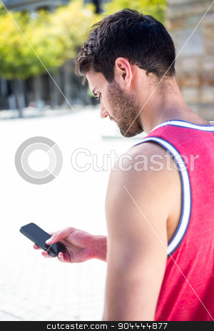 To use this stock image in your creative project, please select the size you need over to the right and click the "Add to Cart" button.
Your downloaded image will come with the Cutcaster watermark removed so don’t worry about the watermark you see on this page. Rear view of an handsome athlete sending a text stock photo, Rear view of an handsome athlete sending a text on a sunny day by Wavebreak Media