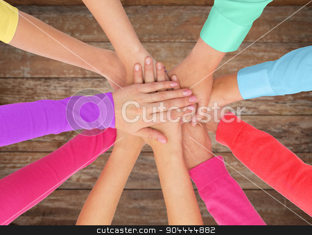 To use this stock image in your creative project, please select the size you need over to the right and click the "Add to Cart" button.
Your downloaded image will come with the Cutcaster watermark removed so don’t worry about the watermark you see on this page. close up of women hands on top in rainbow clothes stock photo, people, gesture, gay pride and homosexual concept - close up of women hands in rainbow clothes on top of each other over wooden background by Syda Productions
