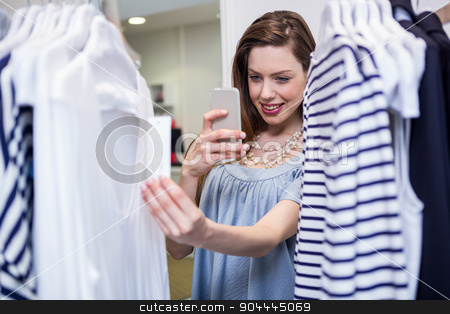 To use this stock image in your creative project, please select the size you need over to the right and click the "Add to Cart" button.
Your downloaded image will come with the Cutcaster watermark removed so don’t worry about the watermark you see on this page. Brunette taking a photo of price tag stock photo, Brunette taking a photo of price tag in fashion boutique by Wavebreak Media