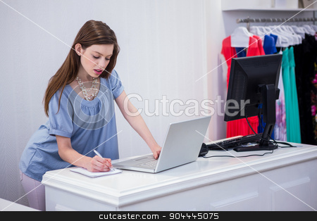 To use this stock image in your creative project, please select the size you need over to the right and click the "Add to Cart" button.
Your downloaded image will come with the Cutcaster watermark removed so don’t worry about the watermark you see on this page. Shop worker using laptop by the till stock photo, Shop worker using laptop by the till in fashion boutique by Wavebreak Media
