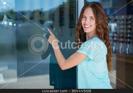 To use this stock image in your creative project, please select the size you need over to the right and click the "Add to Cart" button.
Your downloaded image will come with the Cutcaster watermark removed so don’t worry about the watermark you see on this page. Pretty woman pointing at window stock photo, Pretty woman pointing at window at the optometry store by Wavebreak Media