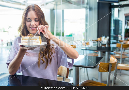 To use this stock image in your creative project, please select the size you need over to the right and click the "Add to Cart" button.
Your downloaded image will come with the Cutcaster watermark removed so don’t worry about the watermark you see on this page. Pretty brunette enjoying a cake stock photo, Pretty brunette enjoying a cake in a coffee shop by Wavebreak Media