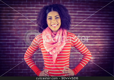 To use this stock image in your creative project, please select the size you need over to the right and click the "Add to Cart" button.
Your downloaded image will come with the Cutcaster watermark removed so don’t worry about the watermark you see on this page. Smiling attractive woman with hands on hips stock photo, Portrait of smiling attractive woman with hands on hips against red brick background by Wavebreak Media