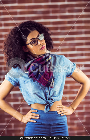To use this stock image in your creative project, please select the size you need over to the right and click the "Add to Cart" button.
Your downloaded image will come with the Cutcaster watermark removed so don’t worry about the watermark you see on this page. Attractive hipster posing with hands on hips stock photo, Attractive hipster posing with hands on hips against red brick background by Wavebreak Media
