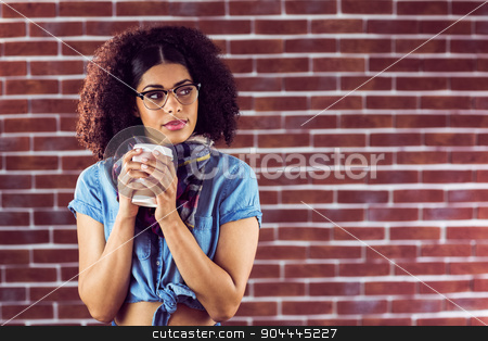 To use this stock image in your creative project, please select the size you need over to the right and click the "Add to Cart" button.
Your downloaded image will come with the Cutcaster watermark removed so don’t worry about the watermark you see on this page. Attractive hipster holding take-away cup stock photo, Attractive hipster holding take-away cup against red brick background by Wavebreak Media