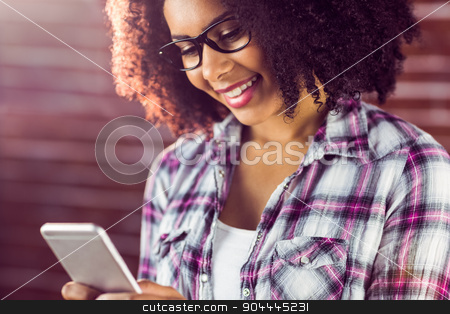 To use this stock image in your creative project, please select the size you need over to the right and click the "Add to Cart" button.
Your downloaded image will come with the Cutcaster watermark removed so don’t worry about the watermark you see on this page. Smiling attractive hipster texting stock photo, Smiling attractive hipster texting against red brick background by Wavebreak Media