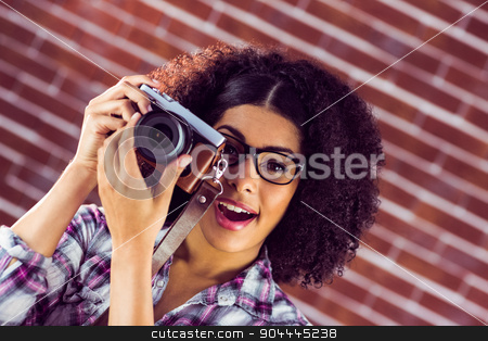 To use this stock image in your creative project, please select the size you need over to the right and click the "Add to Cart" button.
Your downloaded image will come with the Cutcaster watermark removed so don’t worry about the watermark you see on this page. Attractive hipster photographing with camera stock photo, Portrait of attractive hipster photographing with camera against red brick background by Wavebreak Media