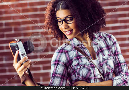 To use this stock image in your creative project, please select the size you need over to the right and click the "Add to Cart" button.
Your downloaded image will come with the Cutcaster watermark removed so don’t worry about the watermark you see on this page. Attractive hipster taking selfies with camera stock photo, Attractive hipster taking selfies with camera against red brick background by Wavebreak Media