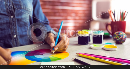 To use this stock image in your creative project, please select the size you need over to the right and click the "Add to Cart" button.
Your downloaded image will come with the Cutcaster watermark removed so don’t worry about the watermark you see on this page. Graphic designer drawing on colour chart stock photo, Graphic designer drawing on colour chart at workplace by Wavebreak Media