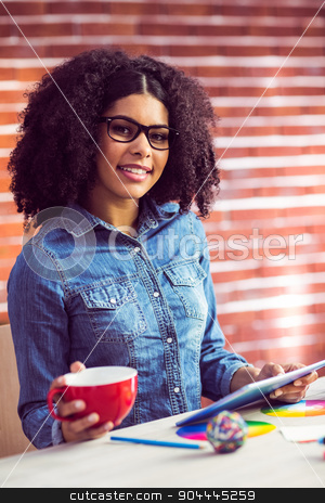 To use this stock image in your creative project, please select the size you need over to the right and click the "Add to Cart" button.
Your downloaded image will come with the Cutcaster watermark removed so don’t worry about the watermark you see on this page. Casual businesswoman on a coffee break stock photo, Casual businesswoman on a coffee break in her office by Wavebreak Media