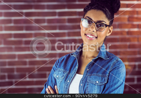 To use this stock image in your creative project, please select the size you need over to the right and click the "Add to Cart" button.
Your downloaded image will come with the Cutcaster watermark removed so don’t worry about the watermark you see on this page. Gorgeous hipster posing with glasses stock photo, Portrait of a gorgeous hipster posing with glasses against red brick background by Wavebreak Media