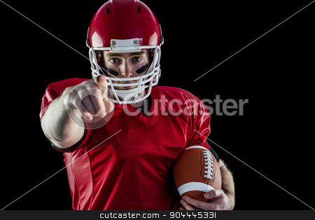 To use this stock image in your creative project, please select the size you need over to the right and click the "Add to Cart" button.
Your downloaded image will come with the Cutcaster watermark removed so don’t worry about the watermark you see on this page. Portrait of american football player holding football and pointi stock photo, Portrait of american football player holding football and pointing to camera against black background by Wavebreak Media