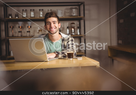 To use this stock image in your creative project, please select the size you need over to the right and click the "Add to Cart" button.
Your downloaded image will come with the Cutcaster watermark removed so don’t worry about the watermark you see on this page. Smiling hipster sitting and using laptop stock photo, Portrait of smiling hipster sitting and using laptop at coffee shop by Wavebreak Media