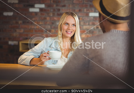To use this stock image in your creative project, please select the size you need over to the right and click the "Add to Cart" button.
Your downloaded image will come with the Cutcaster watermark removed so don’t worry about the watermark you see on this page. Smiling blonde drinking coffee with friend stock photo, Smiling blonde drinking coffee with friend at coffee shop by Wavebreak Media