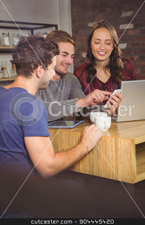 To use this stock image in your creative project, please select the size you need over to the right and click the "Add to Cart" button.
Your downloaded image will come with the Cutcaster watermark removed so don’t worry about the watermark you see on this page. Smiling friends looking at smartphone stock photo, Smiling friends looking at smartphone at coffee shop by Wavebreak Media
