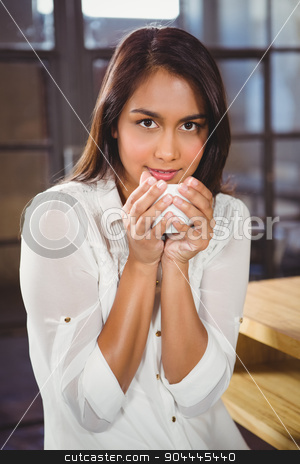 To use this stock image in your creative project, please select the size you need over to the right and click the "Add to Cart" button.
Your downloaded image will come with the Cutcaster watermark removed so don’t worry about the watermark you see on this page. Beautiful woman drinking a coffee and looking away stock photo, Beautiful woman drinking a coffee and looking away in a cafe by Wavebreak Media