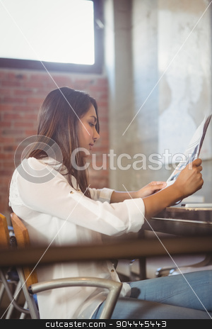 To use this stock image in your creative project, please select the size you need over to the right and click the "Add to Cart" button.
Your downloaded image will come with the Cutcaster watermark removed so don’t worry about the watermark you see on this page. Pretty businesswoman reading newspaper stock photo, Pretty businesswoman reading newspaper in a cafe by Wavebreak Media