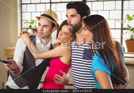 To use this stock image in your creative project, please select the size you need over to the right and click the "Add to Cart" button.
Your downloaded image will come with the Cutcaster watermark removed so don’t worry about the watermark you see on this page. Grimacing friends taking selfies with selfiestick stock photo, Grimacing friends taking selfies with selfiestick at coffee shop by Wavebreak Media