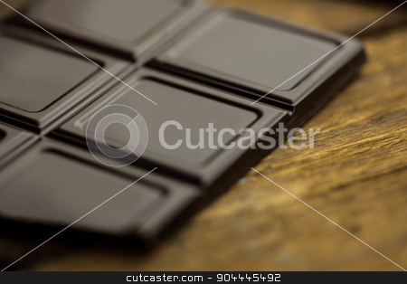 To use this stock image in your creative project, please select the size you need over to the right and click the "Add to Cart" button.
Your downloaded image will come with the Cutcaster watermark removed so don’t worry about the watermark you see on this page. Pieces of chocolate on a wooden table stock photo, Close up view of pieces of chocolate on a wooden table by Wavebreak Media