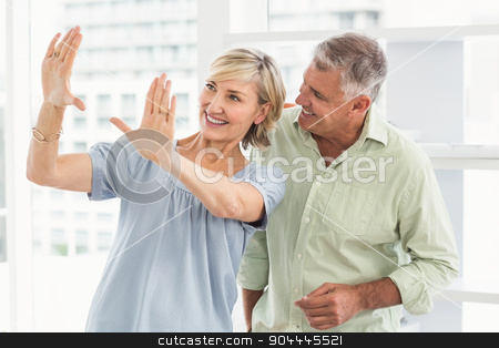 To use this stock image in your creative project, please select the size you need over to the right and click the "Add to Cart" button.
Your downloaded image will come with the Cutcaster watermark removed so don’t worry about the watermark you see on this page. Smiling businesswoman gesturing with hands stock photo, Smiling businesswoman gesturing with hands at the office by Wavebreak Media