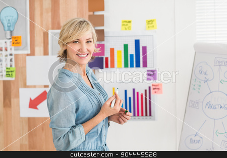 To use this stock image in your creative project, please select the size you need over to the right and click the "Add to Cart" button.
Your downloaded image will come with the Cutcaster watermark removed so don’t worry about the watermark you see on this page. Smiling businesswoman writing on a white board stock photo, Portrait of a smiling businesswoman writing on a white board at office by Wavebreak Media