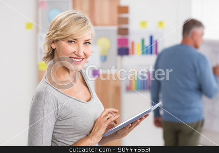To use this stock image in your creative project, please select the size you need over to the right and click the "Add to Cart" button.
Your downloaded image will come with the Cutcaster watermark removed so don’t worry about the watermark you see on this page. Smiling businesswoman using a digital tablet stock photo, Portrait of a smiling businesswoman using a digital tablet at office by Wavebreak Media