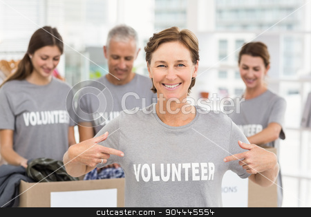 To use this stock image in your creative project, please select the size you need over to the right and click the "Add to Cart" button.
Your downloaded image will come with the Cutcaster watermark removed so don’t worry about the watermark you see on this page. Smiling female volunteer pointing on shirt stock photo, Portrait of smiling female volunteer pointing on shirt in the office by Wavebreak Media
