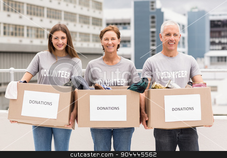 To use this stock image in your creative project, please select the size you need over to the right and click the "Add to Cart" button.
Your downloaded image will come with the Cutcaster watermark removed so don’t worry about the watermark you see on this page. Smiling volunteers holding donation boxes stock photo, Portrait of smiling volunteers holding donation boxes on roof of building by Wavebreak Media