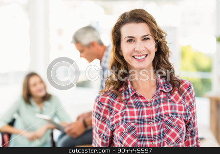 To use this stock image in your creative project, please select the size you need over to the right and click the "Add to Cart" button.
Your downloaded image will come with the Cutcaster watermark removed so don’t worry about the watermark you see on this page. Casual female artist with colleagues in background at office stock photo, Portrait of a casual female artist with colleagues in the background at a bright office by Wavebreak Media