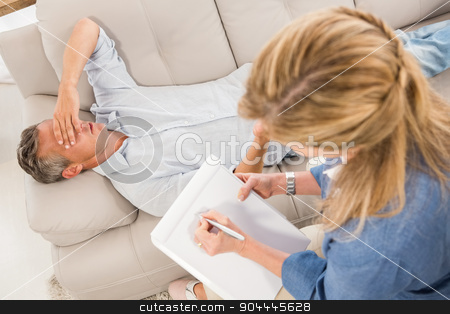 To use this stock image in your creative project, please select the size you need over to the right and click the "Add to Cart" button.
Your downloaded image will come with the Cutcaster watermark removed so don’t worry about the watermark you see on this page. Depressed man lying on couch and talking to therapist stock photo, Depressed man lying on couch and talking to therapist in the office by Wavebreak Media