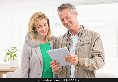 To use this stock image in your creative project, please select the size you need over to the right and click the "Add to Cart" button.
Your downloaded image will come with the Cutcaster watermark removed so don’t worry about the watermark you see on this page. Casual business colleagues working with tablet stock photo, Casual business colleagues working with tablet in the office by Wavebreak Media