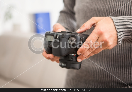 To use this stock image in your creative project, please select the size you need over to the right and click the "Add to Cart" button.
Your downloaded image will come with the Cutcaster watermark removed so don’t worry about the watermark you see on this page. Close up view of hands holding camera stock photo, Close up view of hands holding camera in the office by Wavebreak Media
