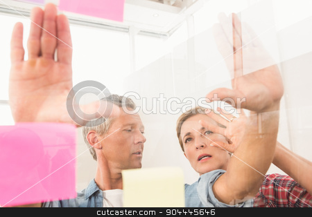 To use this stock image in your creative project, please select the size you need over to the right and click the "Add to Cart" button.
Your downloaded image will come with the Cutcaster watermark removed so don’t worry about the watermark you see on this page. Casual business colleagues working with sticky notes stock photo, Casual business colleagues working with sticky notes in the office by Wavebreak Media