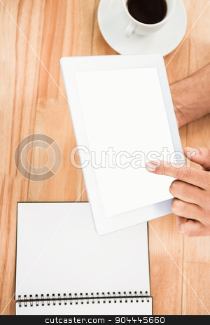 To use this stock image in your creative project, please select the size you need over to the right and click the "Add to Cart" button.
Your downloaded image will come with the Cutcaster watermark removed so don’t worry about the watermark you see on this page. Hands holding blank screen tablet stock photo, Hands holding blank screen tablet on wooden desk by Wavebreak Media