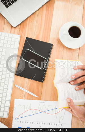 To use this stock image in your creative project, please select the size you need over to the right and click the "Add to Cart" button.
Your downloaded image will come with the Cutcaster watermark removed so don’t worry about the watermark you see on this page. Businessman reading book on wooden desk stock photo, Businessman reading book on wooden desk in the office by Wavebreak Media