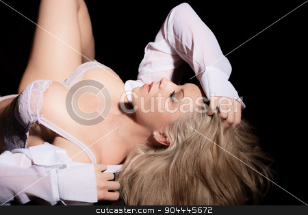 To use this stock image in your creative project, please select the size you need over to the right and click the "Add to Cart" button.
Your downloaded image will come with the Cutcaster watermark removed so don’t worry about the watermark you see on this page. woman in shirt and bra laying on her back stock photo, beautiful woman in shirt and bra laying on her back by sijohnsen