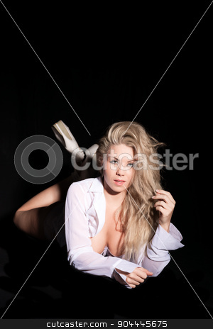 To use this stock image in your creative project, please select the size you need over to the right and click the "Add to Cart" button.
Your downloaded image will come with the Cutcaster watermark removed so don’t worry about the watermark you see on this page. pretty blonde in open shirt stock photo, pretty blonde in open shirt on black background by sijohnsen
